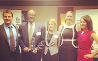 RHA board chairman Jerry Lumpkins and the rest of the Rockford team accept the 2104 NMA Pioneer in Housing Award from John McKay.