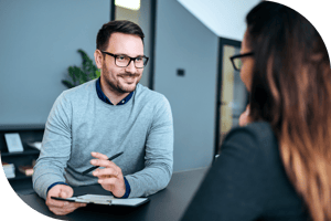 Professional interviewing a housing applicant