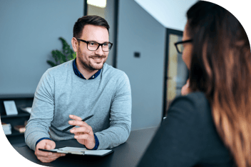 Professional interviewing a housing applicant