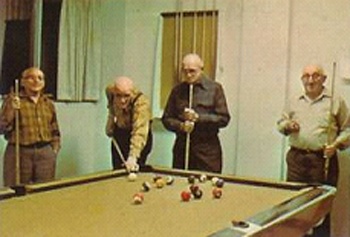 Mike, Frank, and Earl shooting pool at the Nan McKay Building, c. 1970
