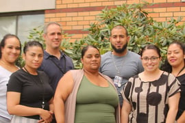 A group of seven in office attire